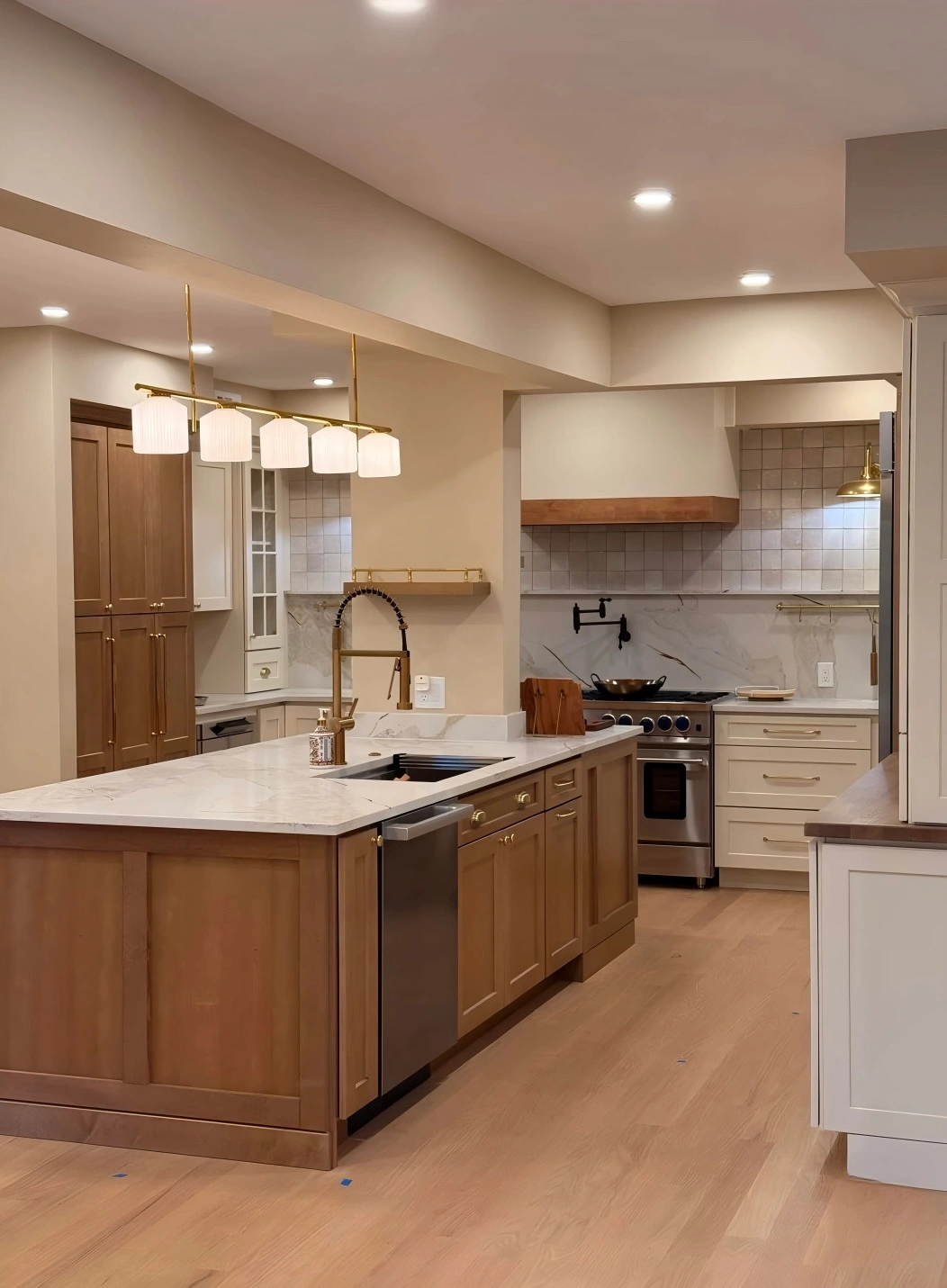 Transitional Kitchen With Warm Wood Cabinetry And Contemporary Finishes Kitchen Remodel by C&M Home Revival project photo