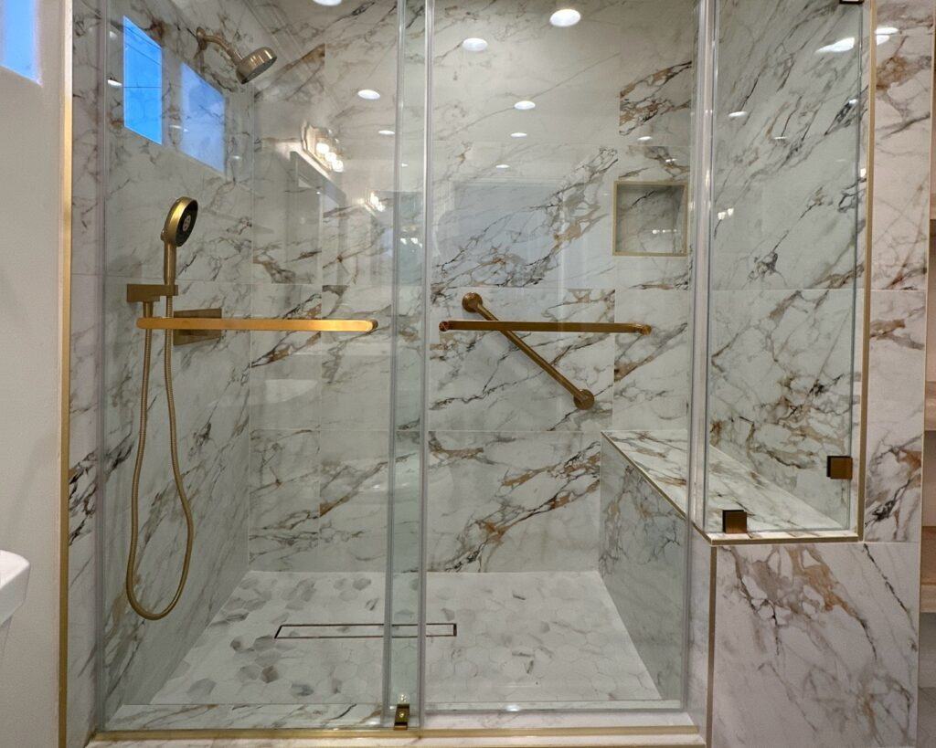 Marble shower with a marble floor