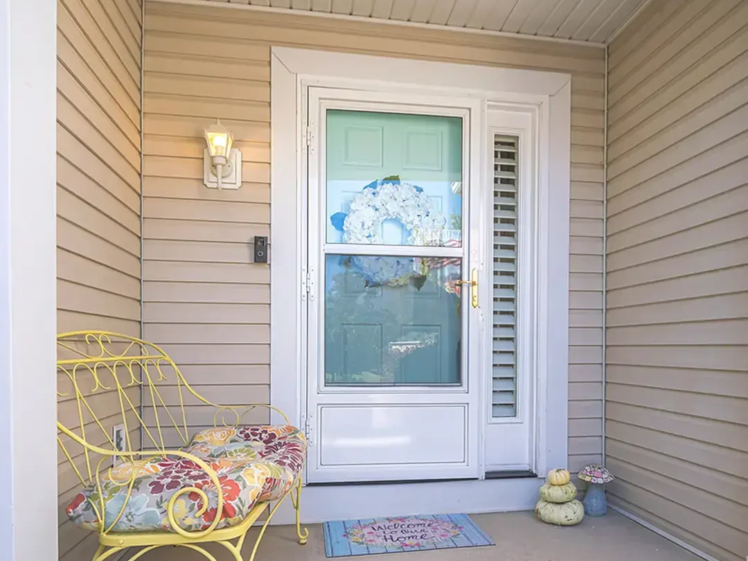 front door hardware white door light yellow siding